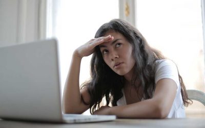 woman annoyed by pop-up advertising on website